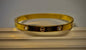 Classic Screw Motif Gold Bangle with Stones