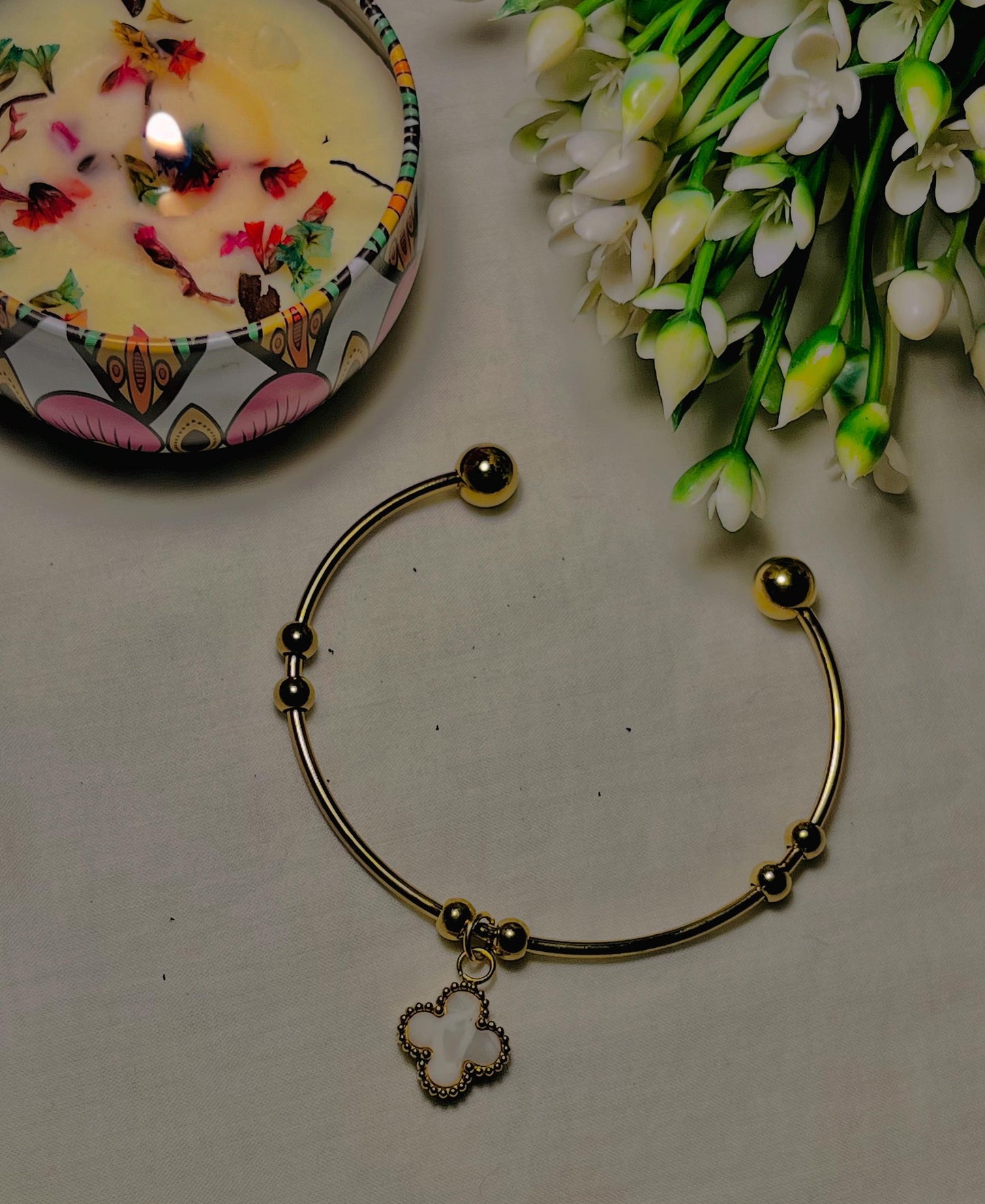 Elegant Gold Stainless Steel Open Bangle with Clover Charm